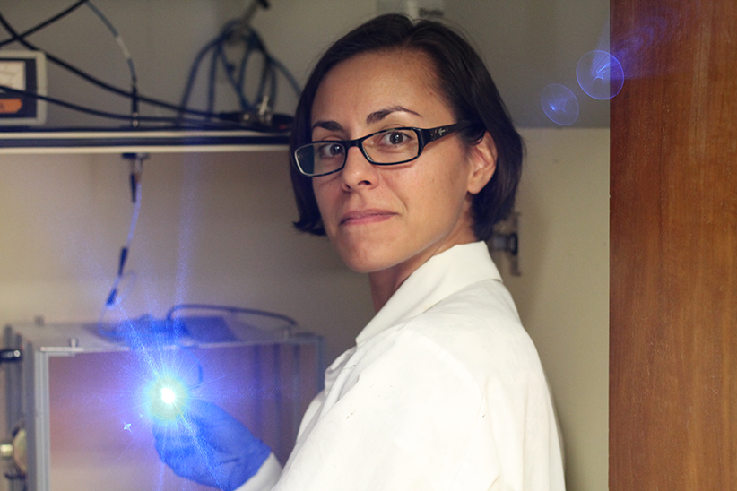 Dr. Diehl setting up an optogenetics experiment and testing the light intensity of a blue laser.