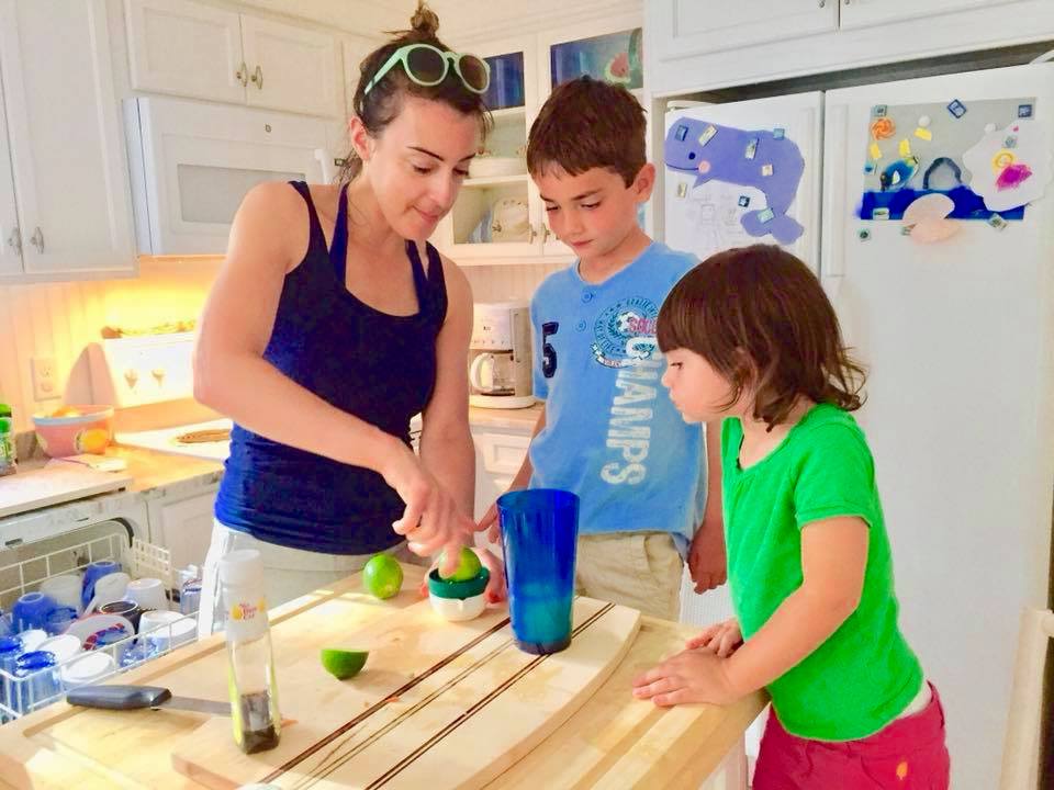 Dr. Shansky (left) teaching her nephew (center) and niece (right) how to make mojitos.