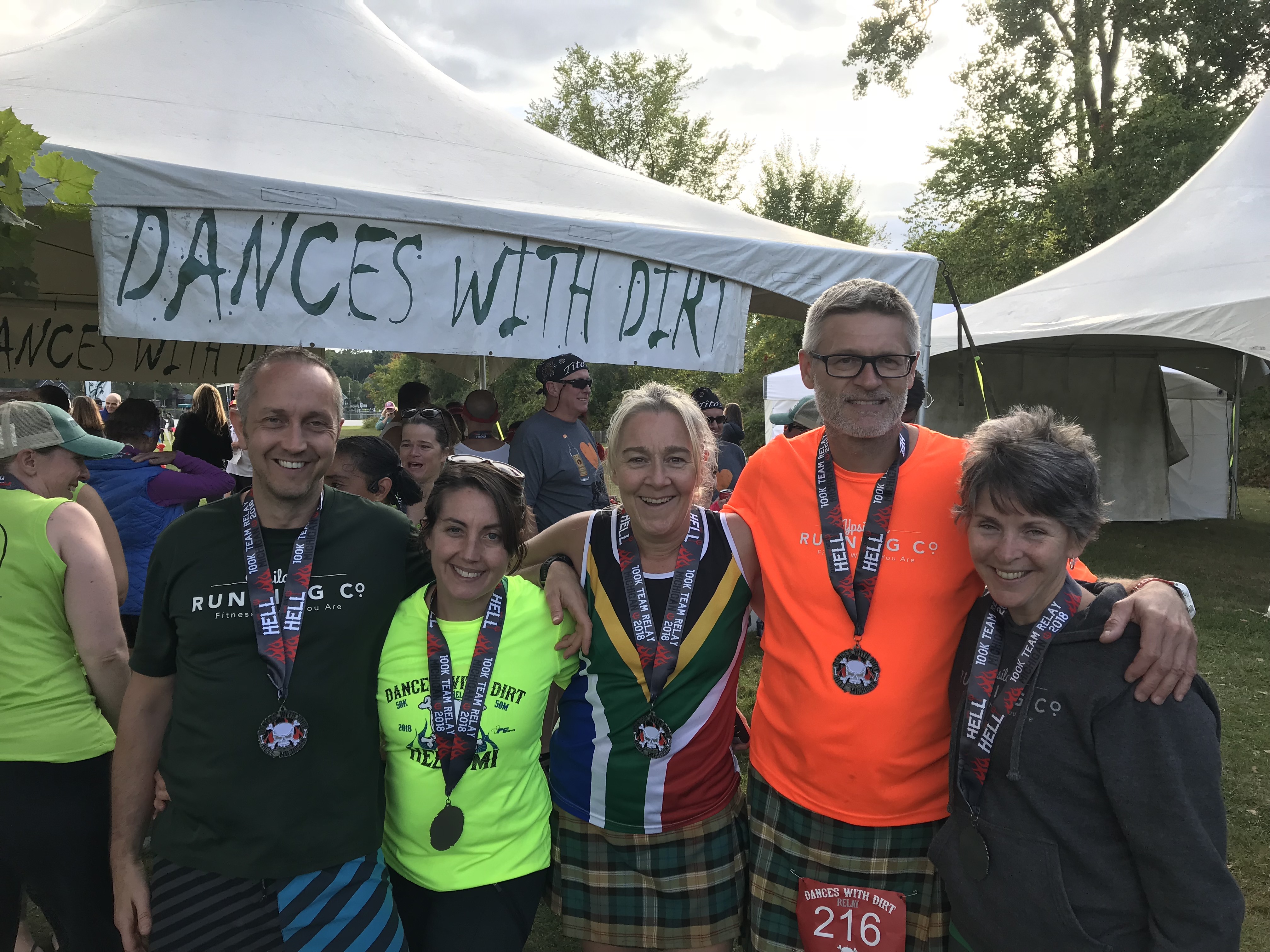 Dr. Tronson (second from left) with her running crew after a race. Dr. Tronson also enjoys spending time with her toddler, music, food (both cooking and eating), and travel.